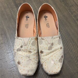 TOMS Cream Canvas Slip-Ons with Gold Pineapple Print